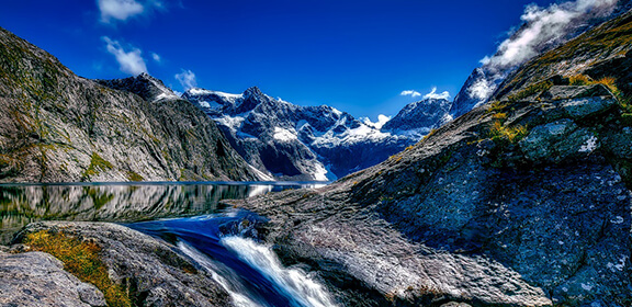 Waterfall and peaks in Milford Sound